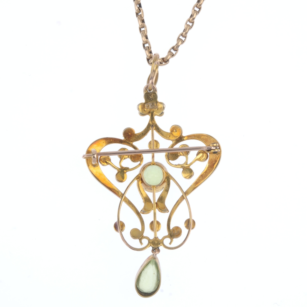 An early 20th century 15ct gold peridot and split pearl pendant. The circular-shape peridot, - Image 2 of 3