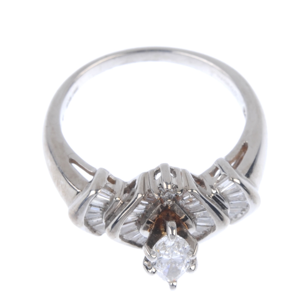 A diamond dress ring. The marquise-shape diamond, with tapered baguette-cut diamond chevron - Image 2 of 4