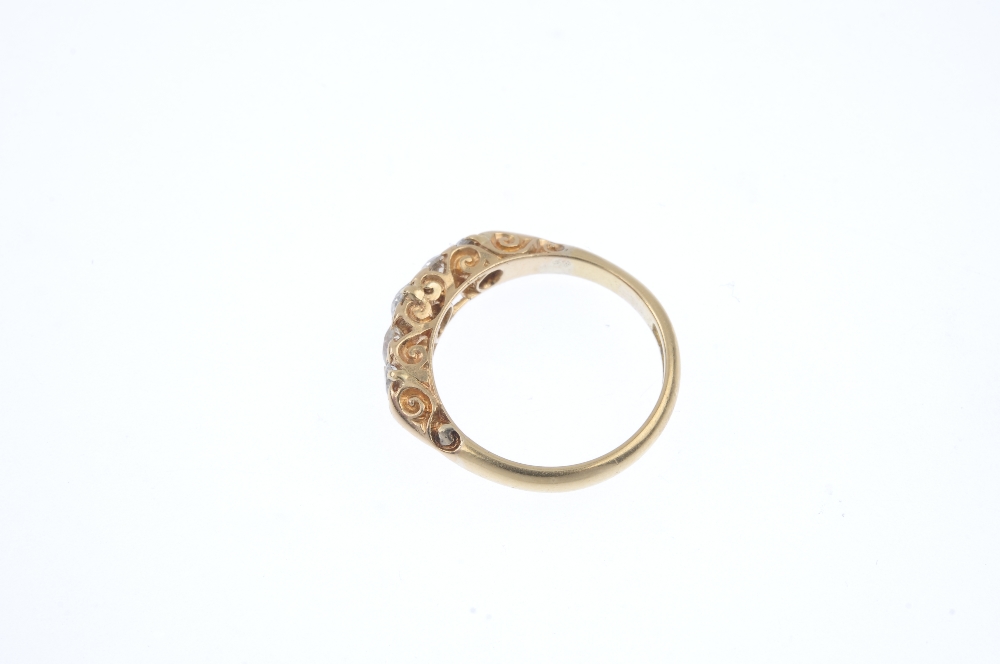 An Edwardian 18ct gold diamond five-stone ring. The graduated old and brilliant-cut diamond line, to - Image 3 of 4