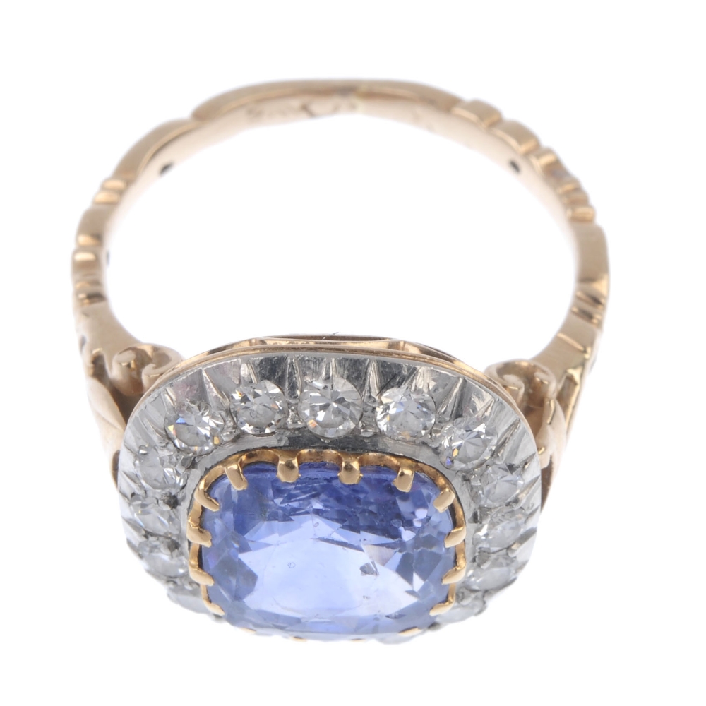 An early 20th century gold and silver sapphire and diamond cluster ring. The cushion-shape sapphire, - Image 2 of 5