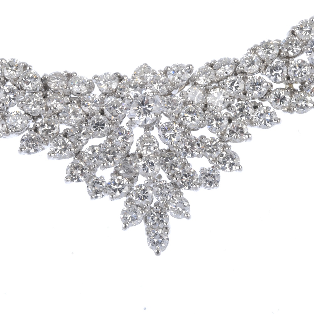 A diamond articulated collar. Comprising a series of five brilliant-cut diamonds, raised within - Image 2 of 4