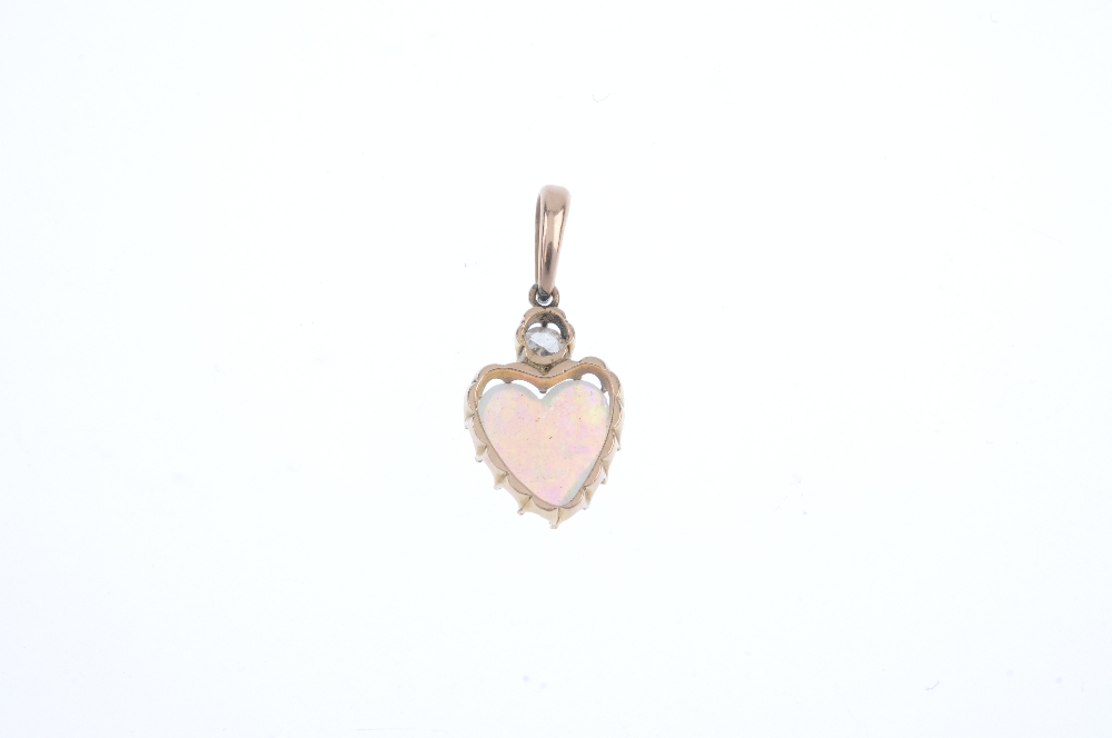 A mid 20th century opal and diamond pendant. The old-cut diamond, set atop a heart-shape opal - Image 2 of 2