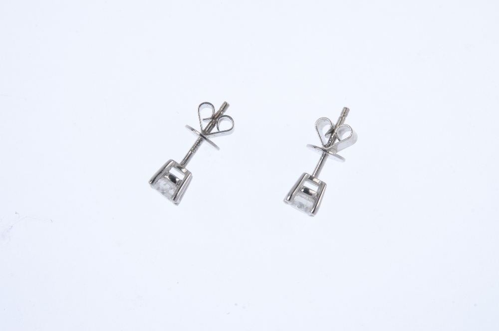 A pair of 18ct gold brilliant-cut diamond ear studs. Total diamond weight 0.50ct, stamped to - Image 2 of 2