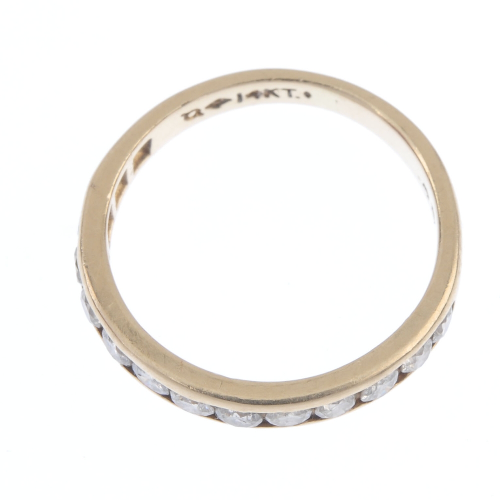 A diamond half-circle eternity ring. The brilliant-cut diamond line, inset to the plain band. - Image 2 of 3