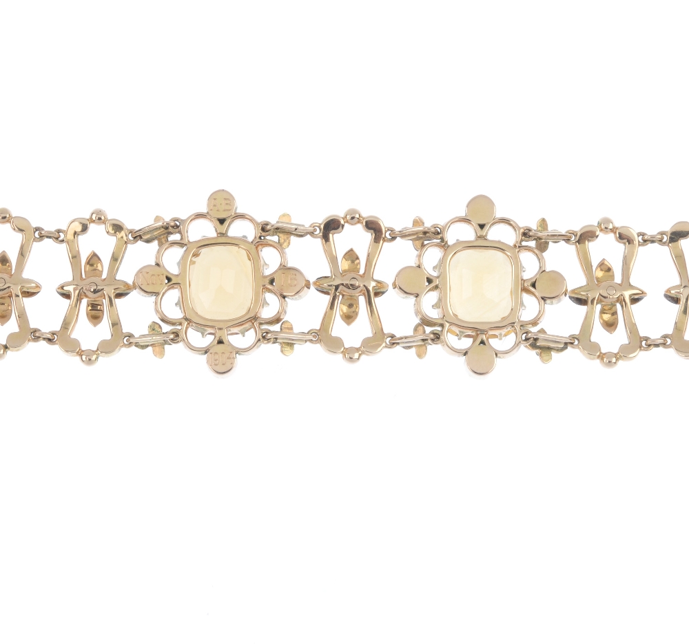 An early 20th century gold citrine, enamel and split pearl bracelet. Designed as two cushion-shape - Image 2 of 3