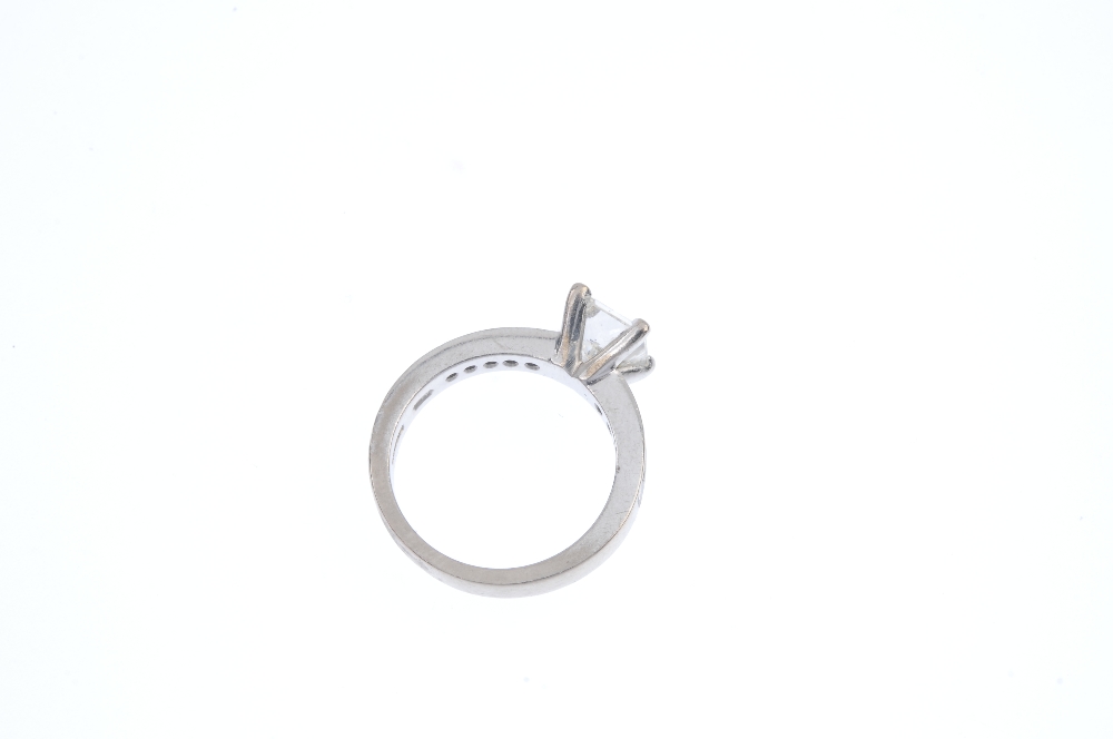An 18ct gold diamond single-stone ring. The square-shape diamond, between similarly-cut diamond - Image 4 of 4