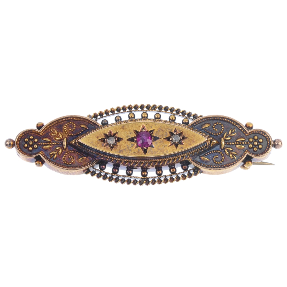 An early 20th century 15ct gold ruby and diamond brooch. The circular-shape ruby and rose-cut