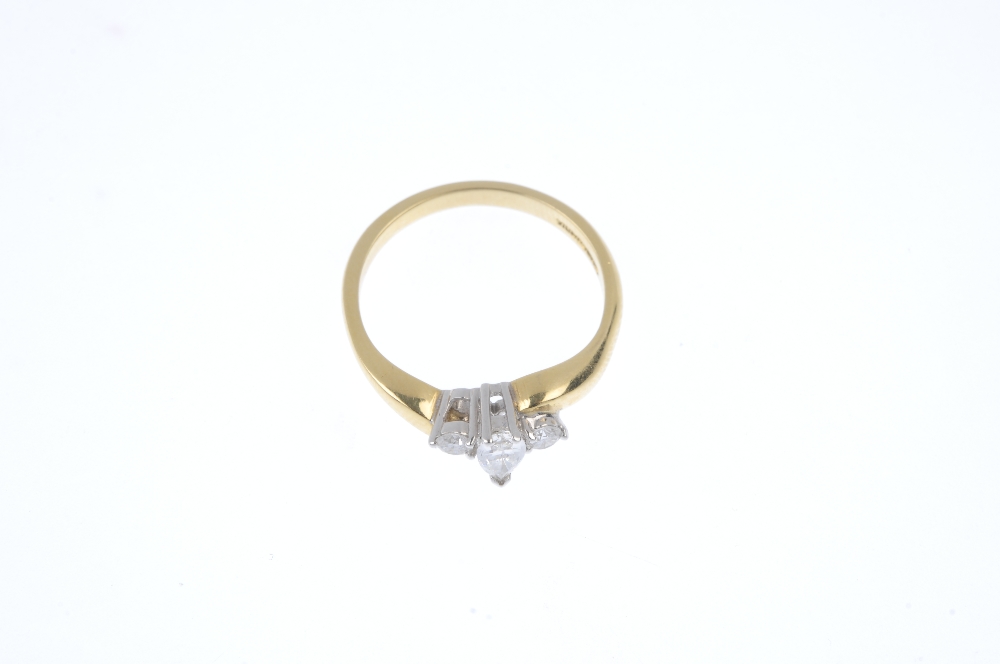 An 18ct gold diamond three-stone ring. The pear-shape diamond, to the brilliant-cut diamond - Image 2 of 4