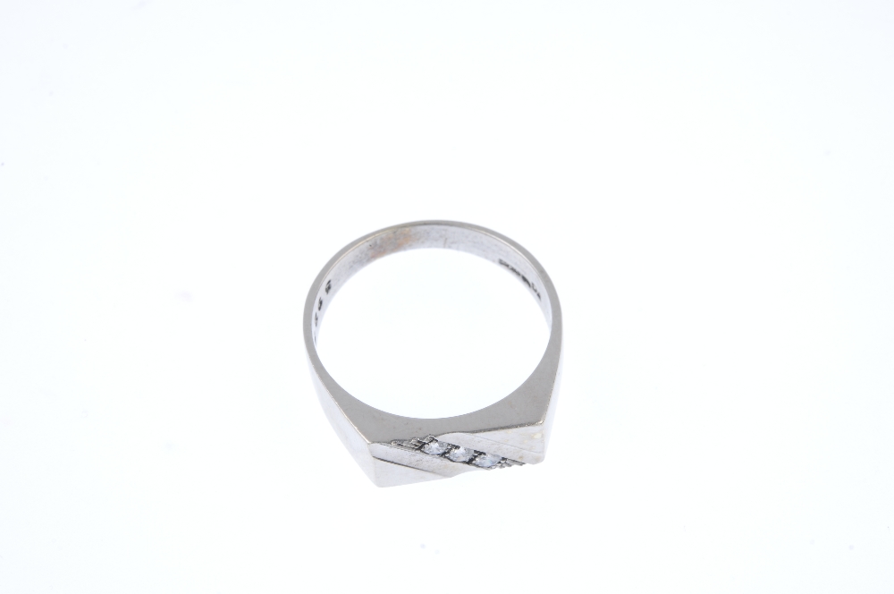 A gentleman's 9ct gold diamond dress ring. The brilliant-cut diamond slanted line with ridged sides, - Image 2 of 4