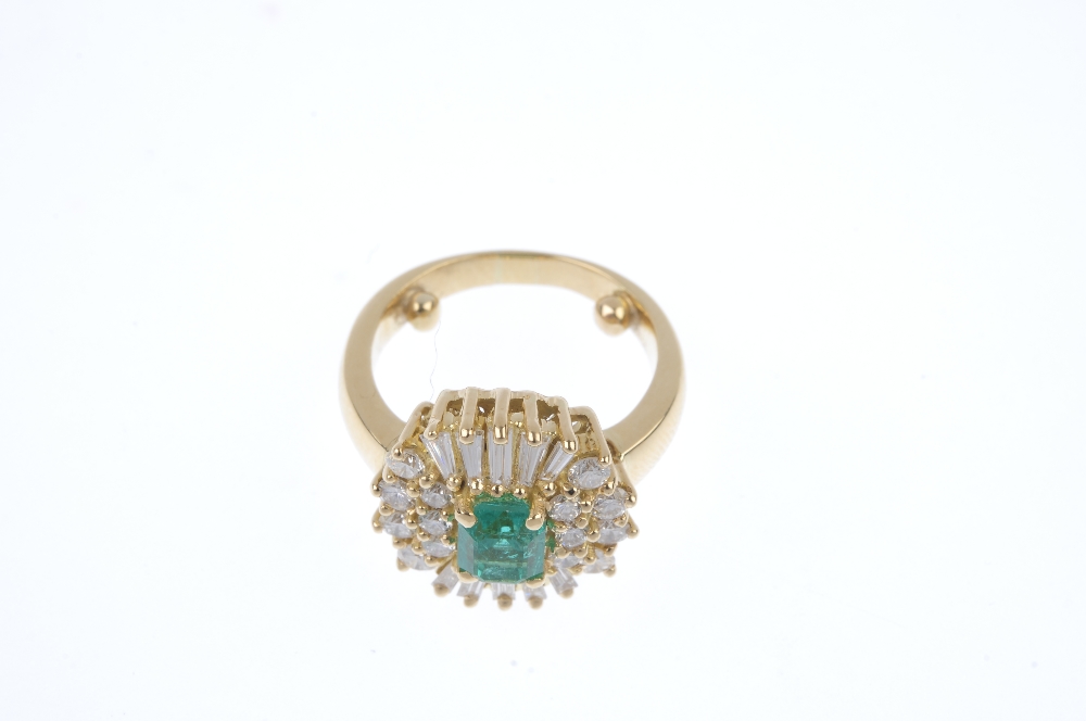 An emerald and diamond cluster ring. The rectangular-shape emerald, within a baguette and - Image 2 of 4