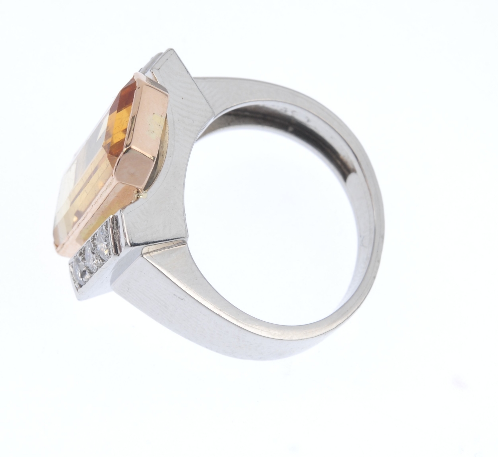 A topaz and diamond dress ring. The rectangular-shape golden topaz collet, to the brilliant-cut - Image 3 of 4