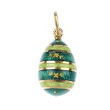 FABERGE - an 18ct gold enamel egg pendant. Designed as a series of green guilloche enamel bands,