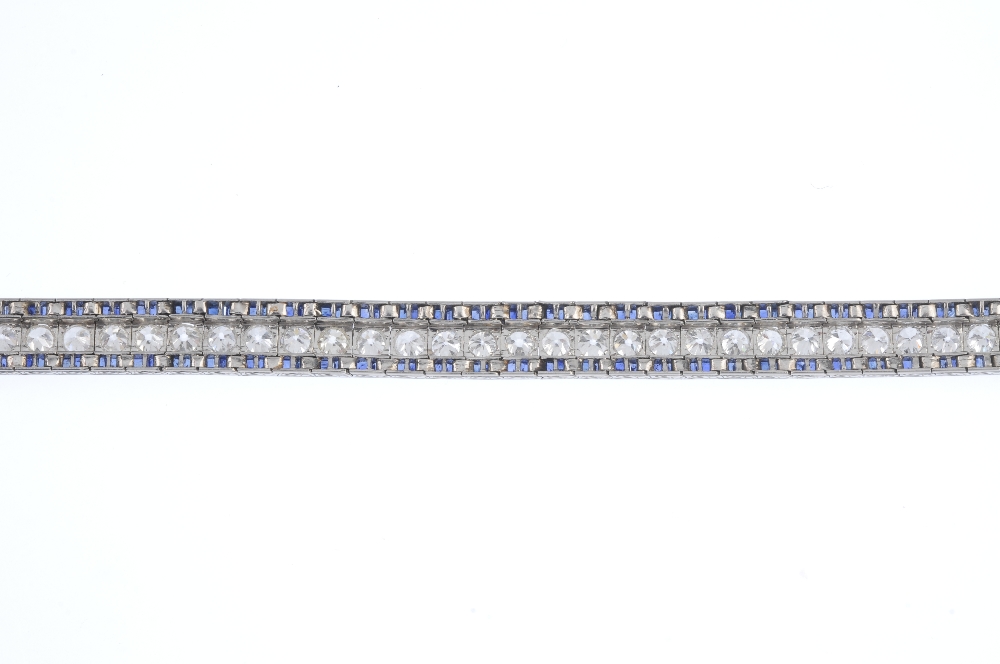 A mid 20th century diamond and sapphire bracelet. The circular-cut diamond line, with calibre-cut - Image 2 of 5