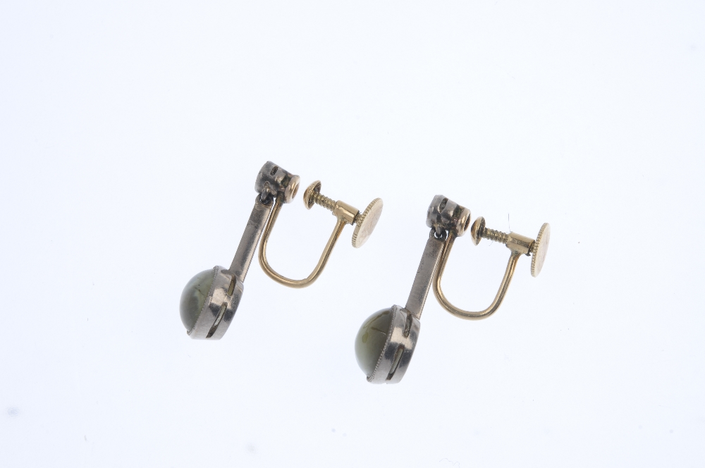 A pair of early 20th century gold chysoberyl and diamond ear pendants. Each designed as a - Image 2 of 3