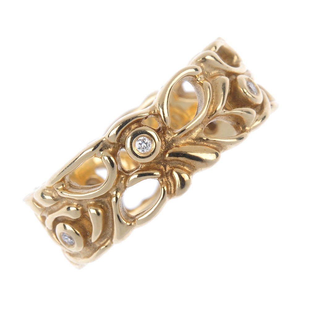 PANDORA - a 14ct gold diamond ring. Of openwork foliate design, with brilliant-cut diamond collet