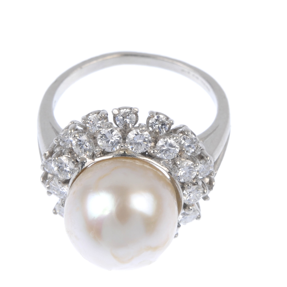 A cultured pearl and diamond cluster ring. The cultured pearl, measuring 20mms, within a brilliant- - Image 2 of 4