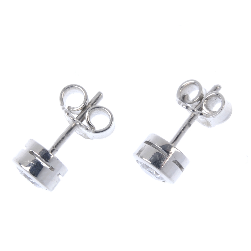 A pair of brilliant-cut diamond collet ear studs. Estimated total diamond weight 0.65ct, H-I colour, - Image 2 of 2
