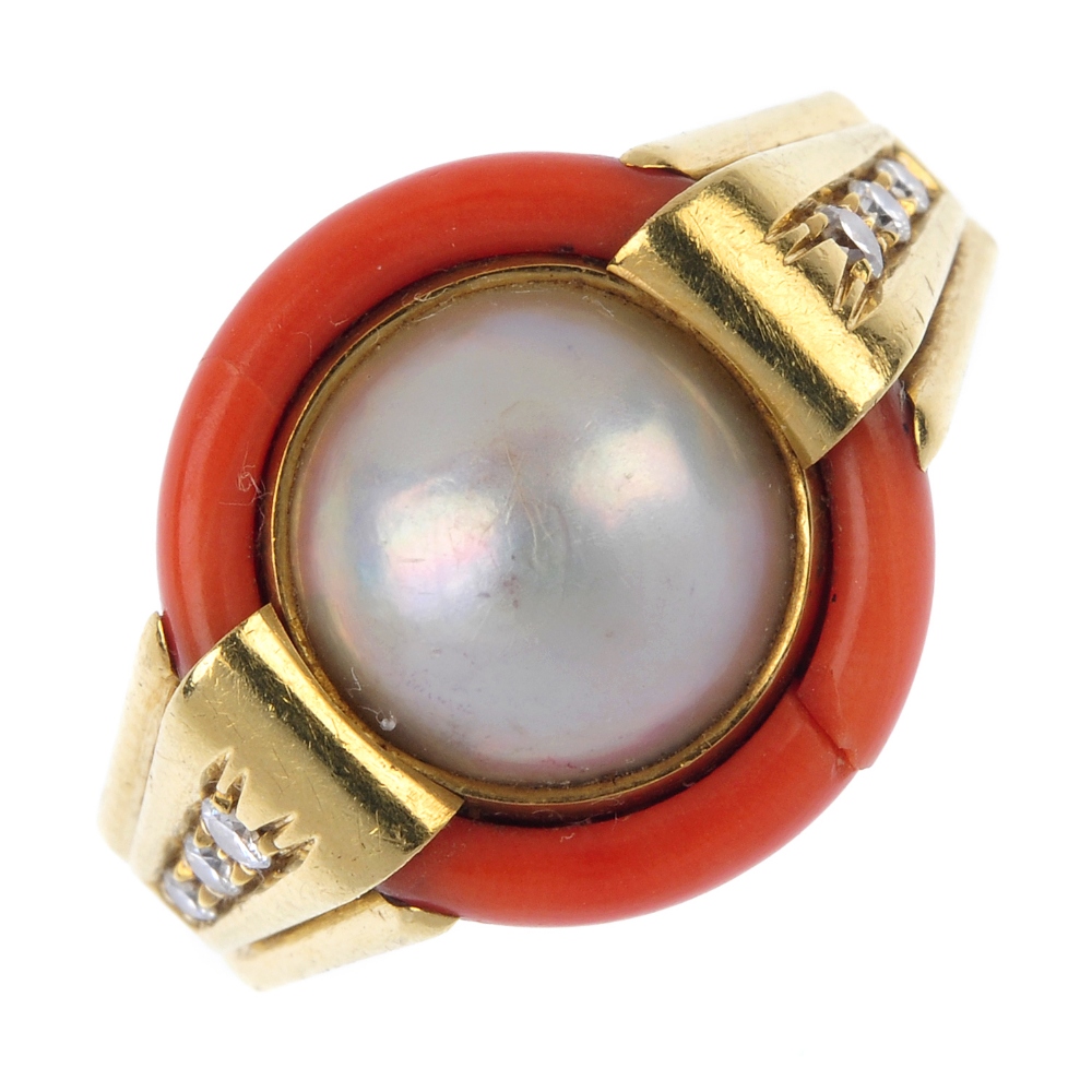 A mabe pearl, coral and diamond dress ring. The mabe pearl, within a coral surround, to the