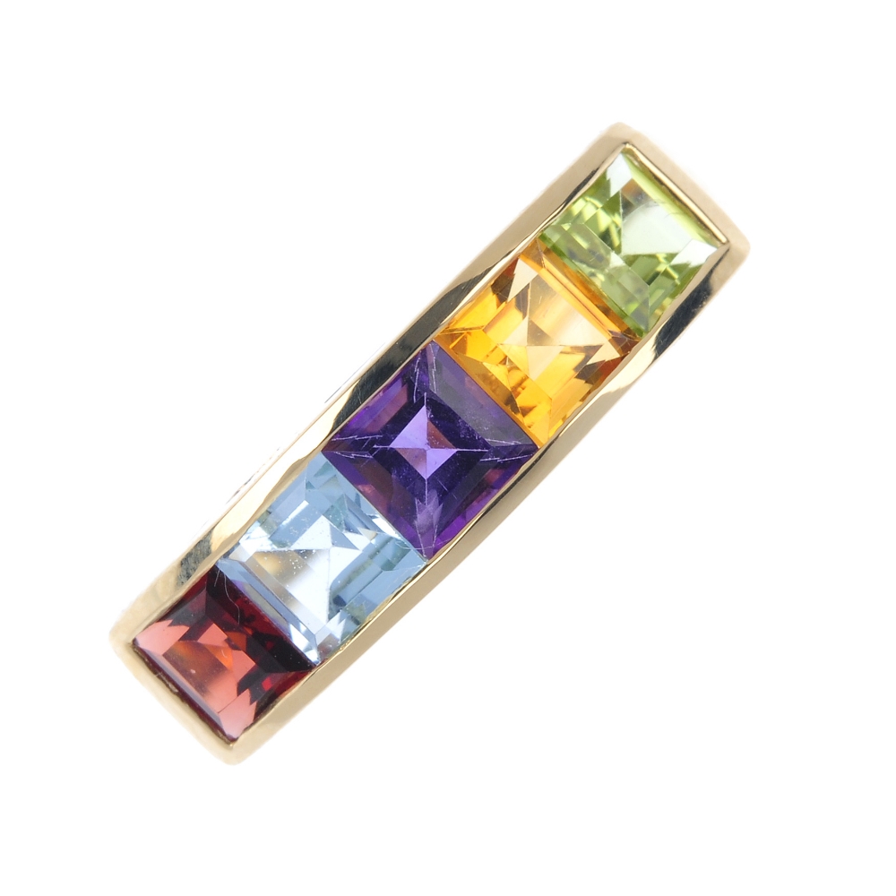 An 18ct gold multi-gem five stone ring. The square-shape garnet, blue topaz, amethyst, citrine,