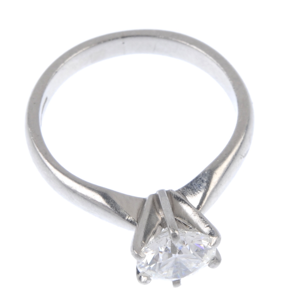 A platinum diamond single-stone ring. The brilliant-cut diamond, to the plain band. Estimated - Image 2 of 4