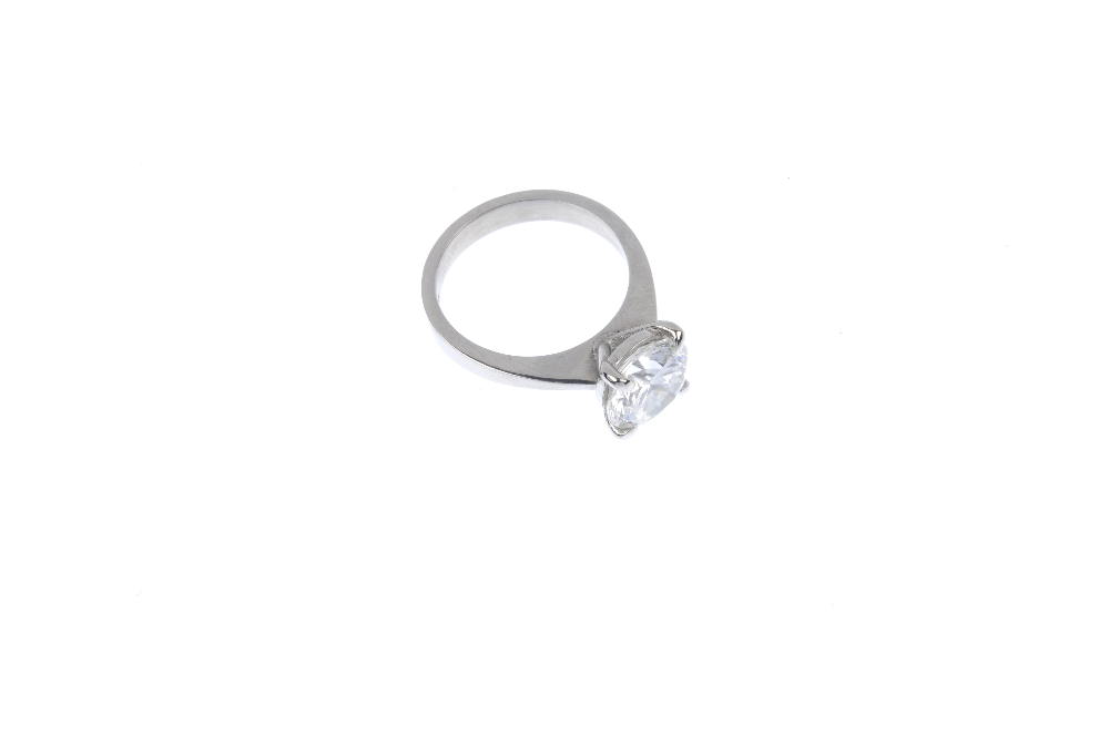 An 18ct gold diamond single-stone ring. The brilliant-cut diamond, weighing 3.02cts, to the plain - Image 3 of 4