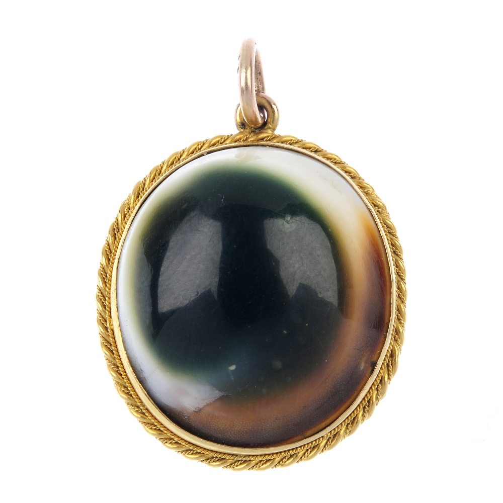 An operculum pendant. The oval-shape shell operculum, to the late 19th century gold rope-twist