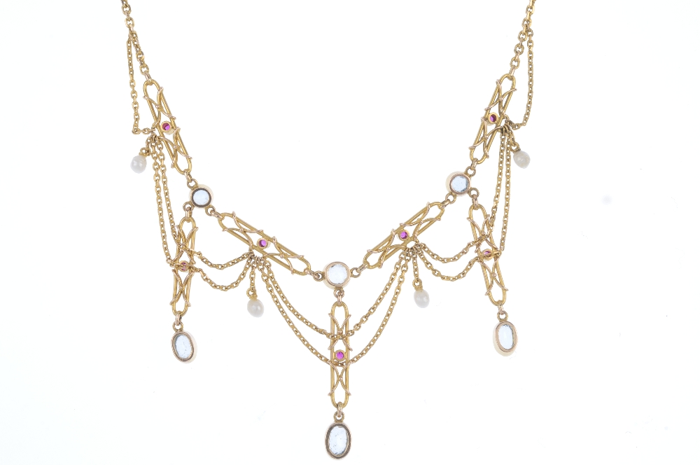 An aquamarine, ruby and seed pearl necklace. The front designed as a series of alternating - Image 2 of 3