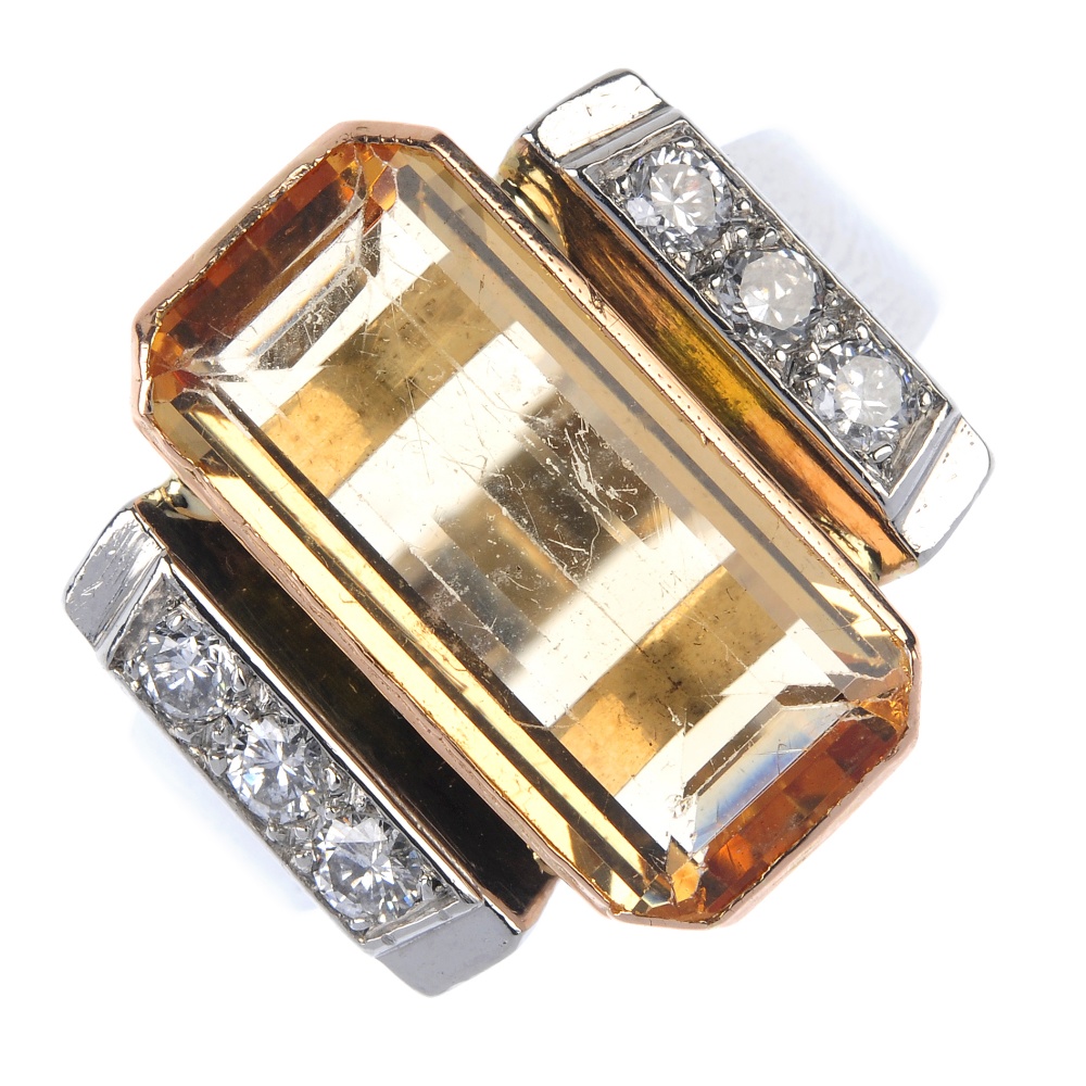 A topaz and diamond dress ring. The rectangular-shape golden topaz collet, to the brilliant-cut