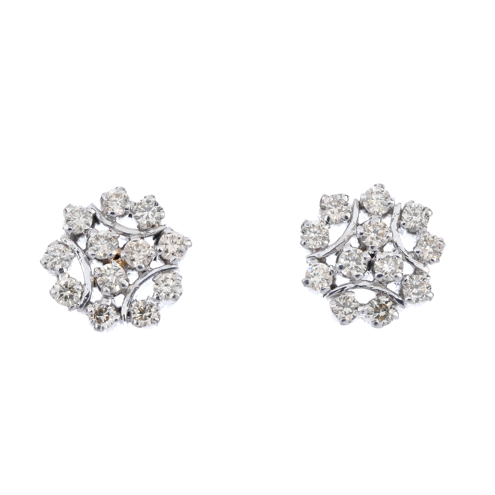 A pair of diamond cluster ear studs. Each of openwork design, the brilliant-cut diamond trefoil,