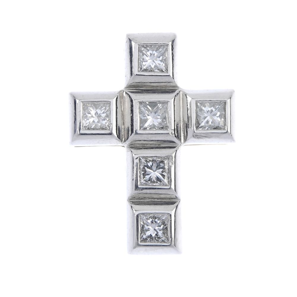 BOODLE & DUNTHORNE - an 18ct gold diamond millennium cross. Designed as a series of square-shape