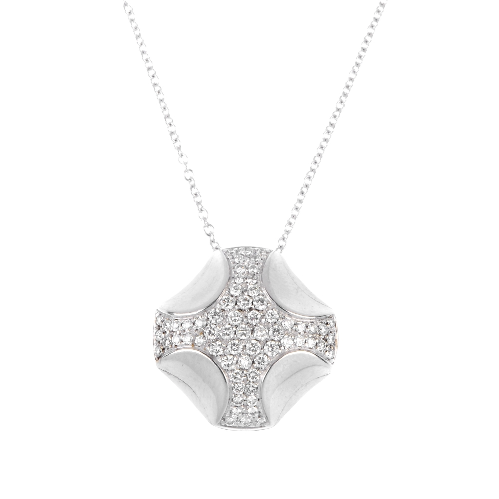 ASPREY - a diamond pendant. The brilliant-cut diamond cross, with concave detail, suspended from