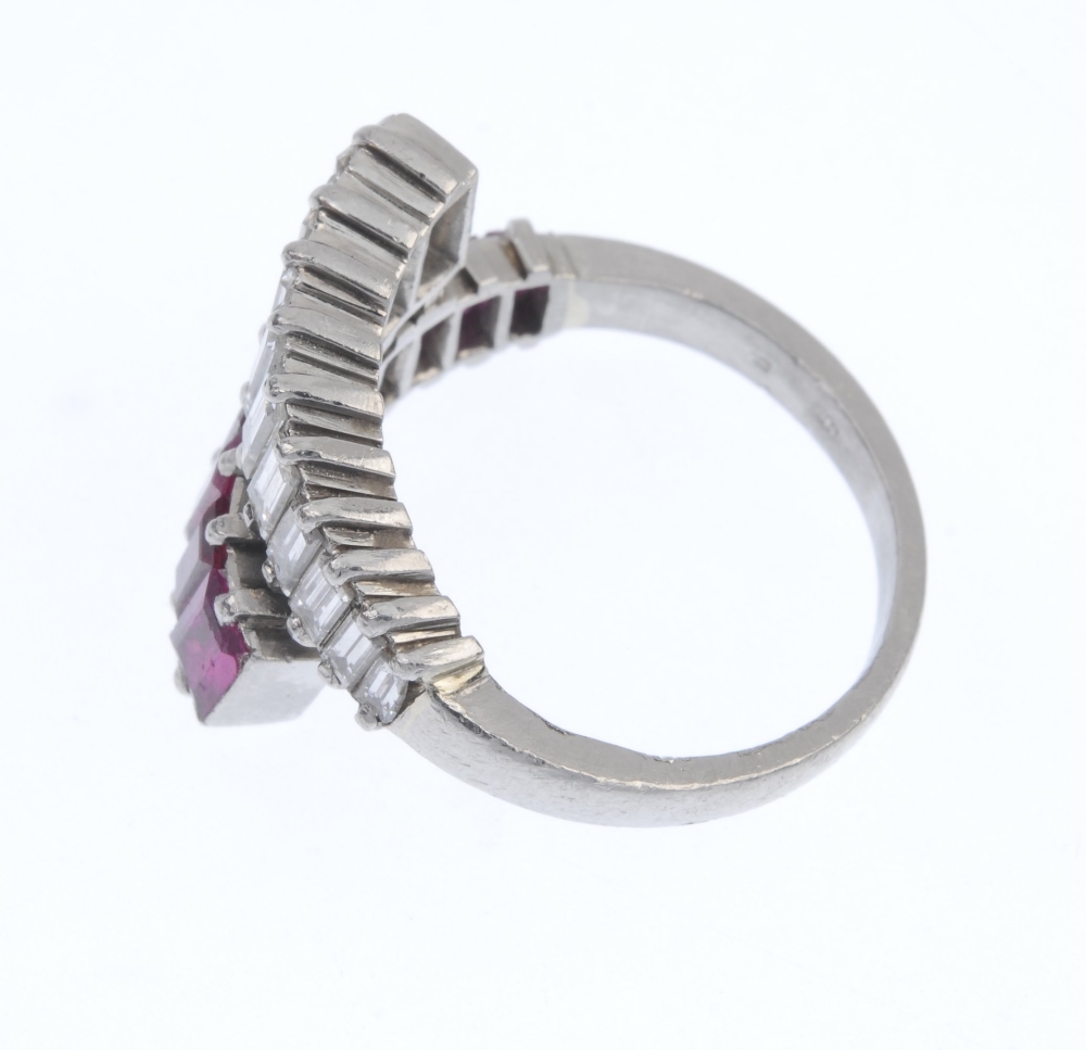 A mid 20th century Burmese ruby and diamond crossover ring. Comprising two graduated baguette-cut - Image 3 of 5