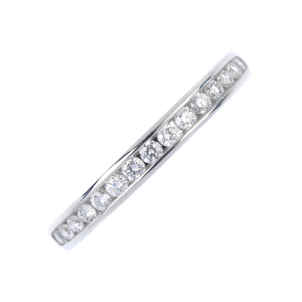 TIFFANY & CO. - a platinum diamond half-circle eternity ring. The brilliant-cut diamond line, within