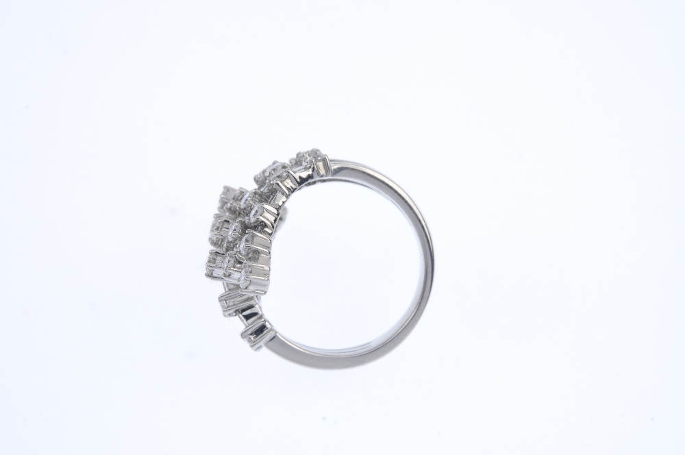 A diamond crossover ring. Comprising a stepped series of alternating brilliant and baguette-cut - Image 3 of 4