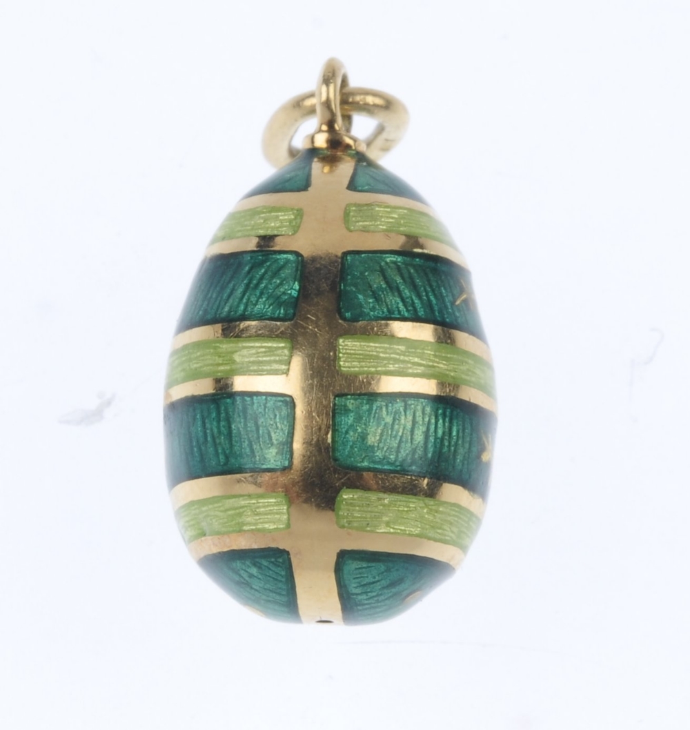 FABERGE - an 18ct gold enamel egg pendant. Designed as a series of green guilloche enamel bands, - Image 2 of 3