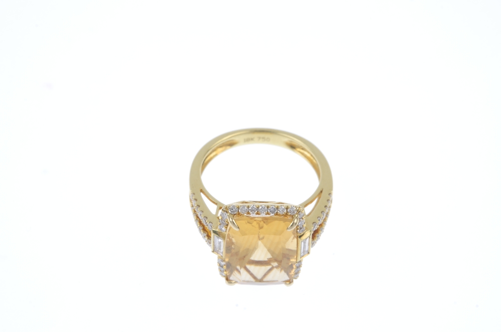 A citrine and diamond dress ring. The rectangular-shape citrine, within a brilliant-cut diamond - Image 2 of 4