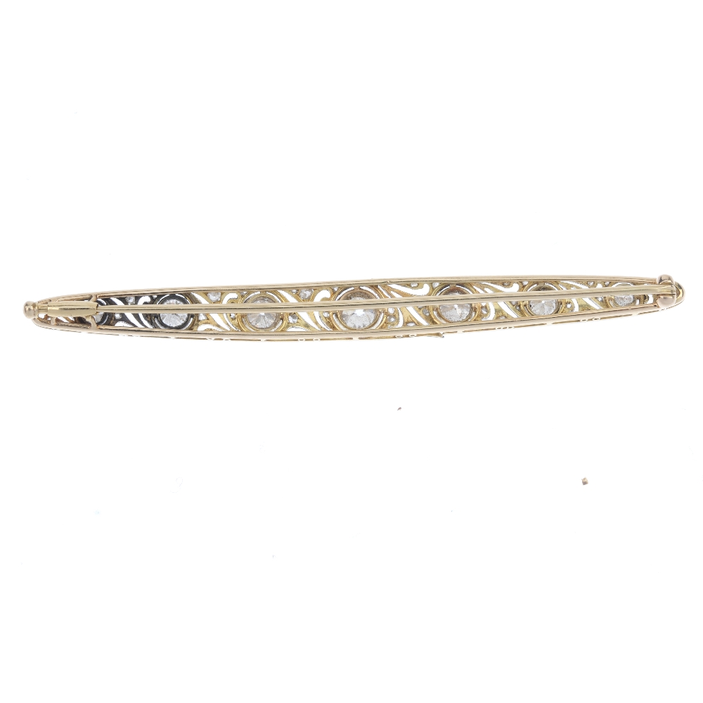 An early 20th century diamond bar brooch. Designed as a series of graduated old-cut diamond collets, - Image 2 of 2