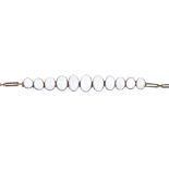 A moonstone bracelet. Designed as a graduated series of oval moonstone cabochon collets, to the