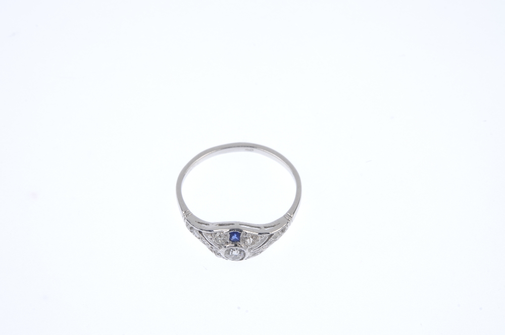 A diamond and sapphire dress ring. The old-cut diamond collet, within a similarly-set diamond and - Image 2 of 4