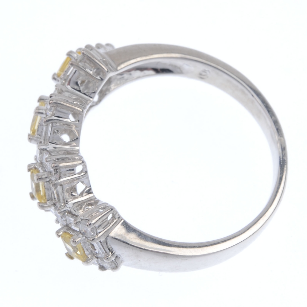 A sapphire and diamond dress ring. Designed as a series of four square-shape yellow sapphires, - Image 3 of 4