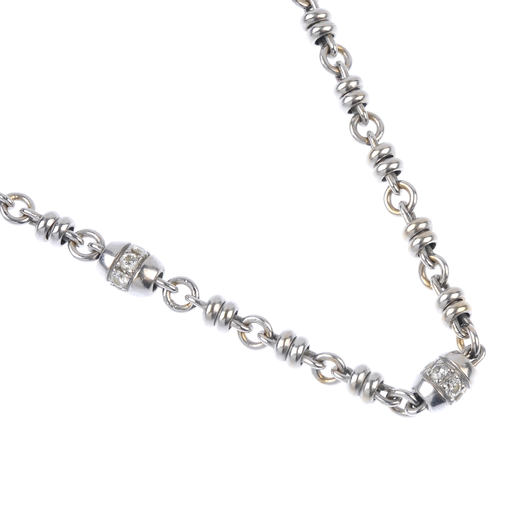 THEO FENNELL - an 18ct gold diamond necklace. Designed as a series of brilliant-cut diamond barrel-