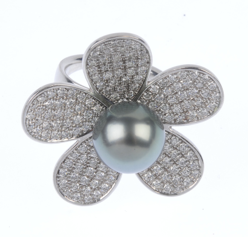 A cultured pearl and diamond flower ring. The grey cultured pearl, measuring 12.8mms, within a - Image 3 of 3