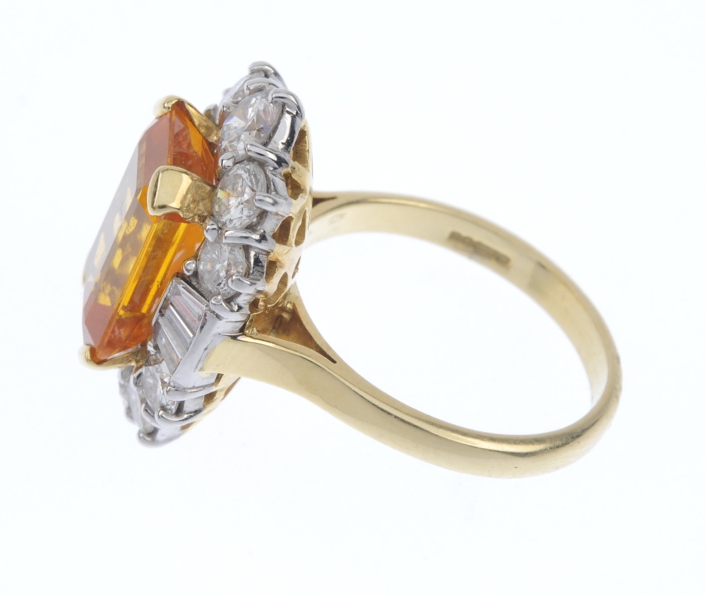 An 18ct gold sapphire and diamond cluster ring. The rectangular-shape orange sapphire, within a - Image 3 of 4