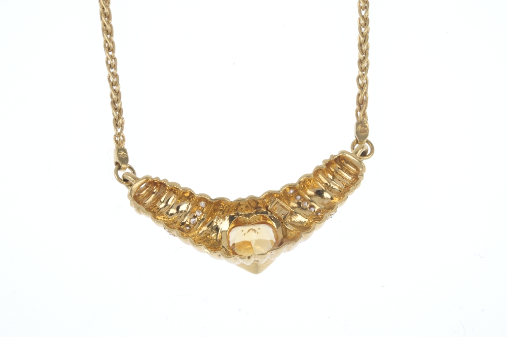 A citrine and diamond necklace.The heart-shape citrine collet, inset to the grooved chevron panel, - Image 2 of 3