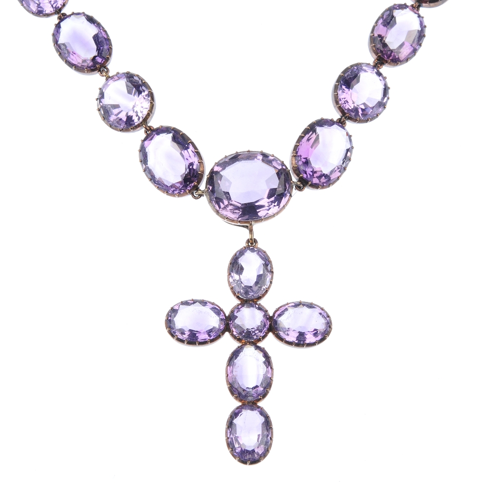 A group of amethyst jewellery. To include an early 20th century amethyst cross pendant suspended