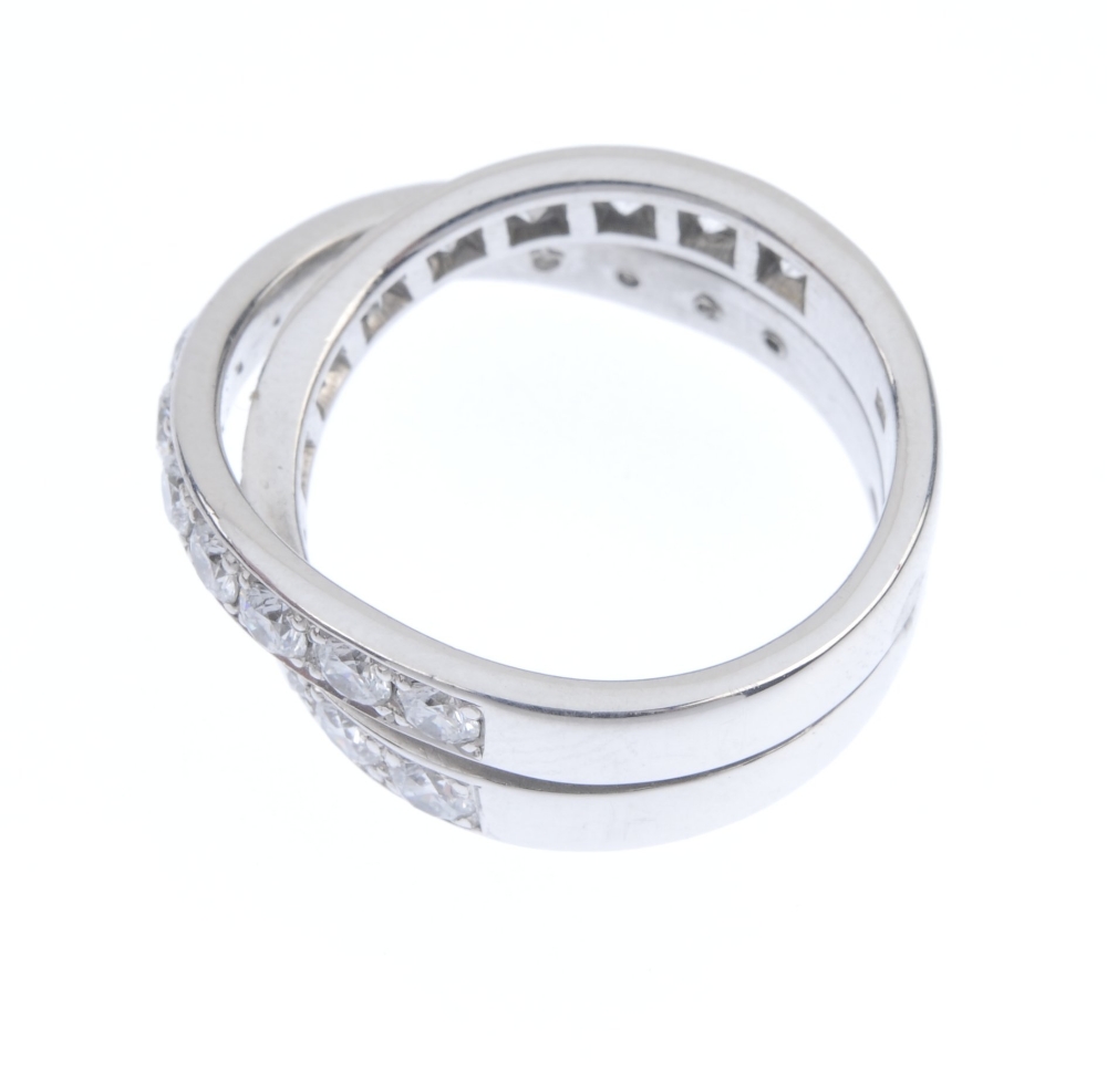 CARTIER - a diamond 'Paris Nouvelle Vague' ring. Comprising two brilliant-cut diamond crossover - Image 3 of 4