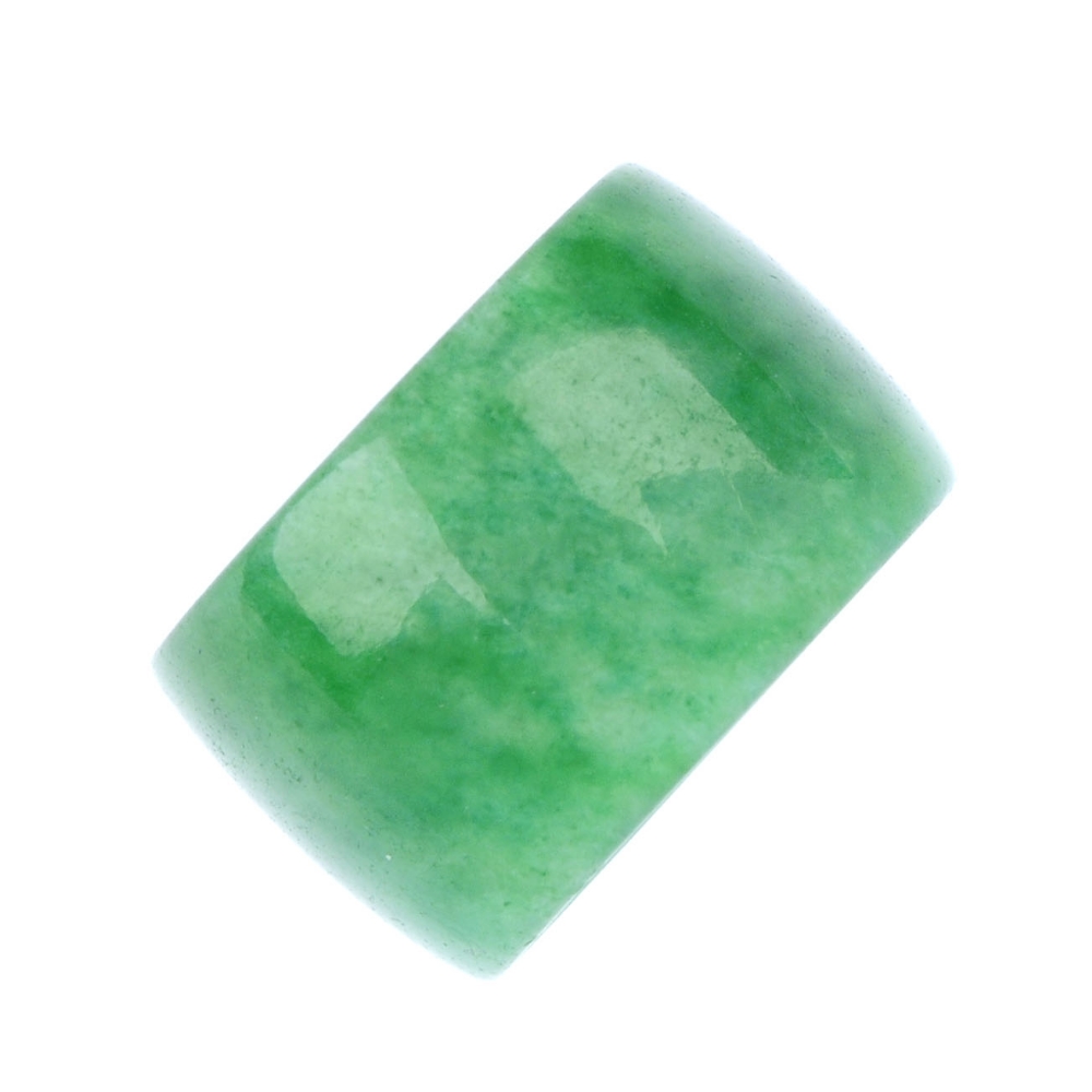 A jade bead. Designed as a jadeite polished cylindrical bead. Length 8.75mms. Weight 1.3gms. Jade