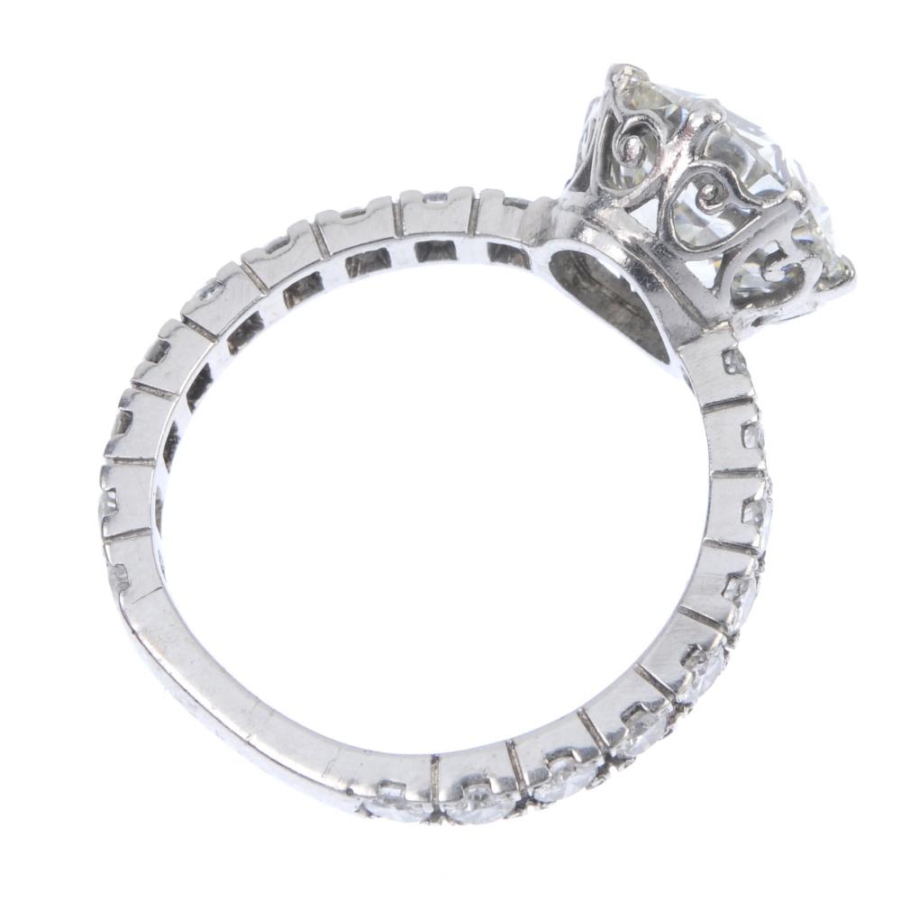 A diamond single-stone ring. The brilliant-cut diamond, weighing 4.69cts, to the similarly-cut - Image 4 of 5