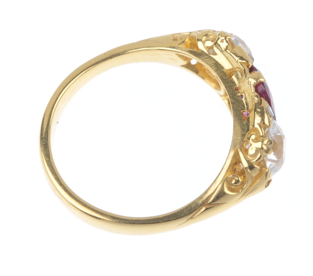 A ruby and diamond three-stone ring. The rectangular-shape ruby and old-cut diamond line, with - Image 4 of 4