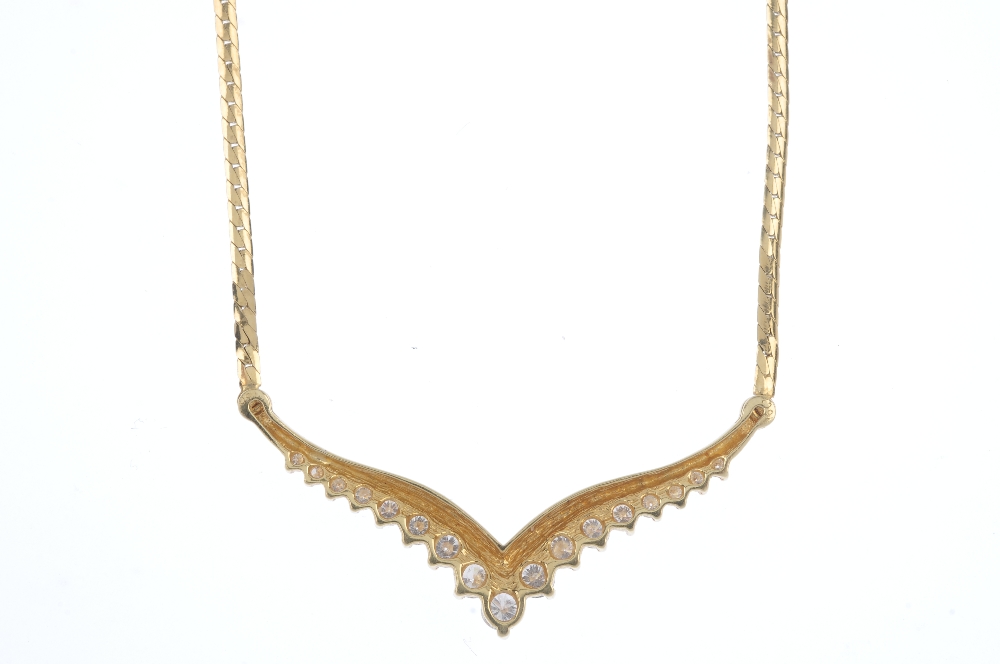 An 18ct gold diamond necklace. The graduated brilliant-cut diamond chevron, to the flattened curb- - Image 2 of 3